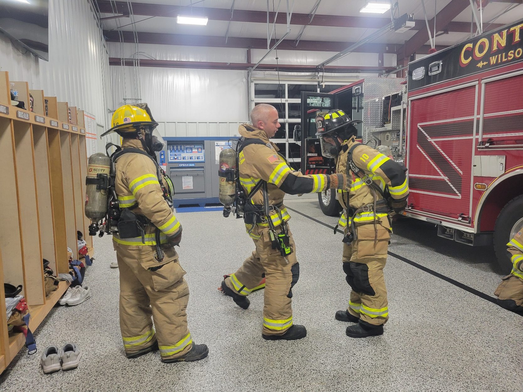 Contentnea firefighters preparing protective equipment and SCBA